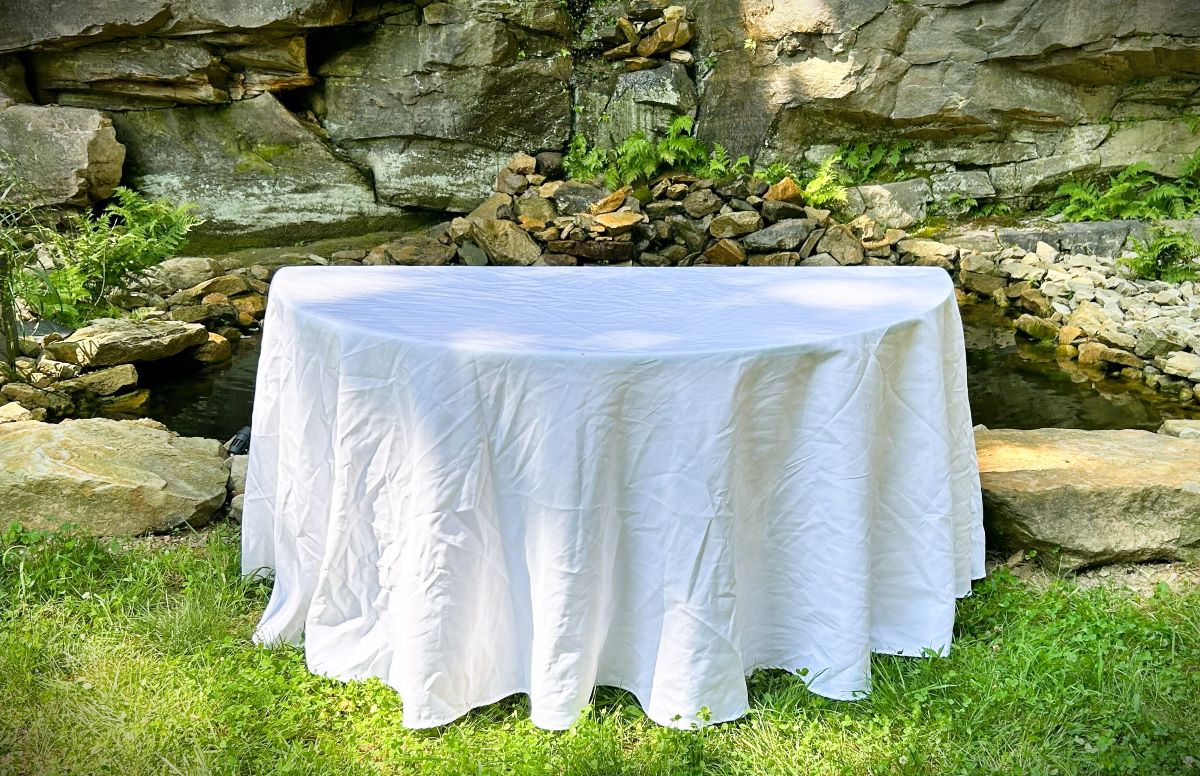 our half-round table - shown with optional white linen